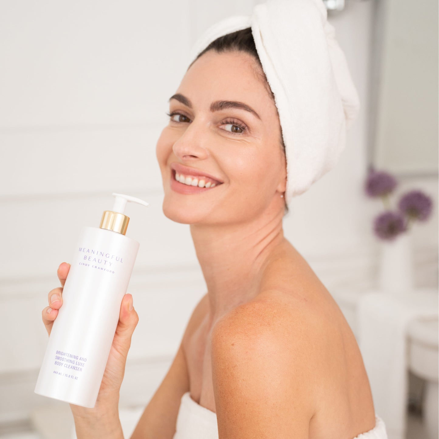 Third lifestyle photo of Brightening and Smoothing Luxe Body Cleanser in use