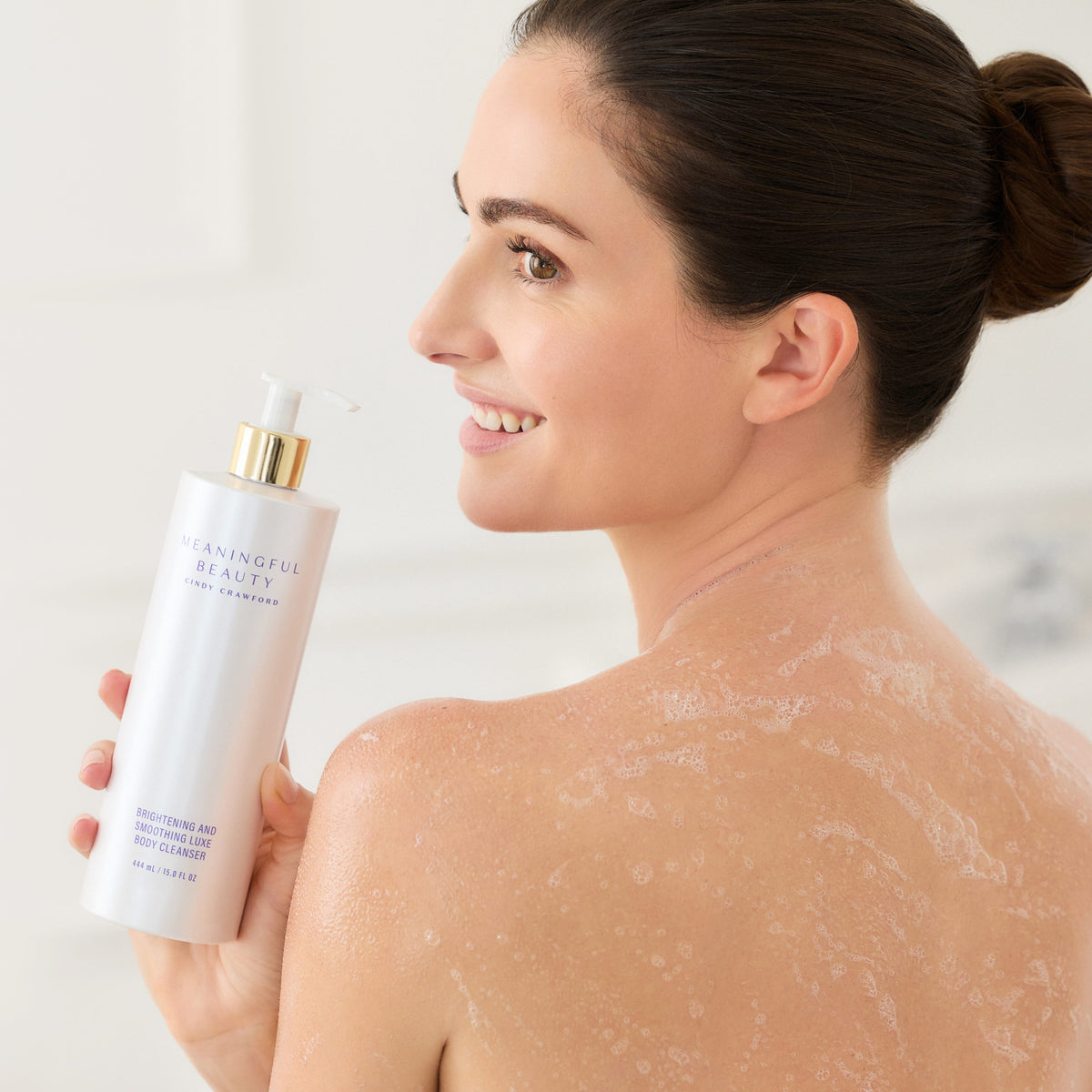 Lifestyle photo of Brightening and Smoothing Luxe Body Cleanser in use