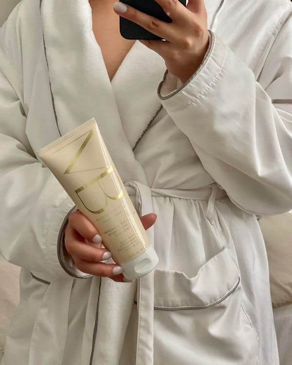 Image of woman holding Firming & Tightening Body Hydration Treatment